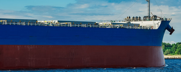Blue cargo ship underway