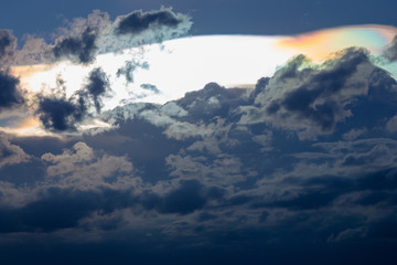 Obraz na płótnie Canvas Cloud iridescence, diffraction phenomenon produce very vivid color and make cloud shine like a corona