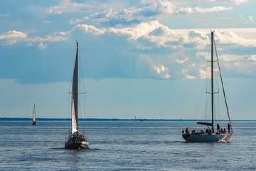Sailboats traveling by Baltic sea