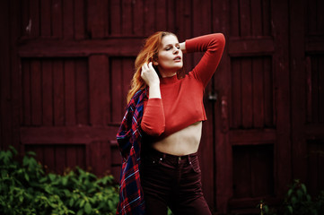 Fototapeta premium Fashion portrait of redhaired sexy girl outdoor. Model attractive seduction woman.