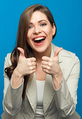Happy woman wearing business suit doing thumb up.