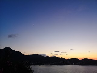 Fototapeta premium Sunset above island mountains