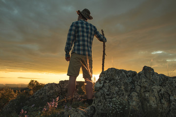 Guy hiking in the mountains