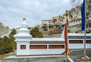 Wall with prayer drums in the village Braka, Nepal.