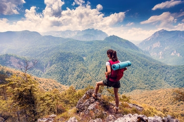 Fototapeta na wymiar Female hiker enjoying beautiful mountain view