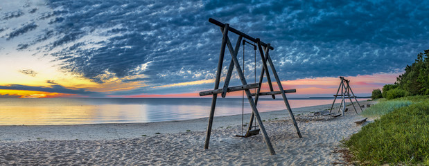 Coastal landscape at colorful dawn, sandy beach of the Baltic Sea