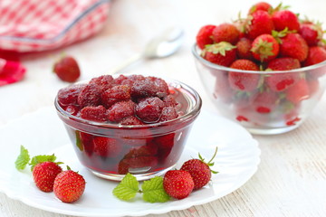 Strawberry jam in a glass bowl