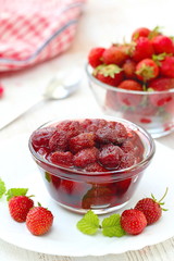 Strawberry jam in a glass bowl