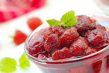 Strawberry jam in a glass bowl