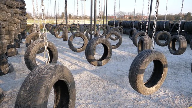 Car tires suspended on chain as a runmageddon competition game phase
