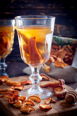 Compote of dried fruits with ingridients on rustic wooden background