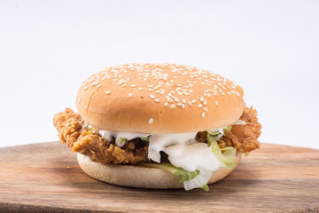 Crispy chicken burger with lettuce, cheese, and mayonnaise