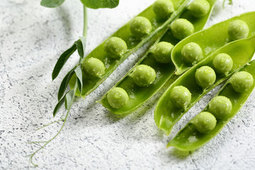 Rich harvest of green peas close-up