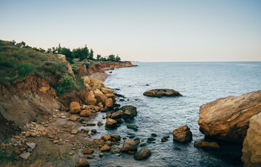 Fototapeta na wymiar Sea landscape, rocks, waves breaking about the shore.
