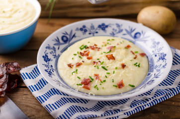 Mashed potatoes, fresh herb and crispy bacon in