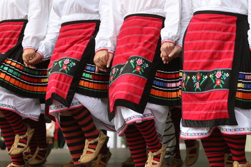 Vratsa, Bulgaria - June 24, 2018: People in traditional authentic folklore costume a meadow near Vratsa, Bulgaria