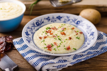 Mashed potatoes, fresh herb and crispy bacon in