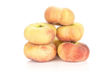 Fresh ripe Saturn peaches heap isolated on white background.