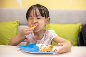 Asian Little Chinese Girl Eating pizza