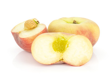 One fresh ripe Saturn peach and two halves isolated on white background.