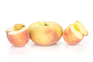 One fresh ripe Saturn peach with two halves isolated on white background.