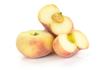 Fresh ripe Saturn peaches heap and two sliced halves isolated on white background.