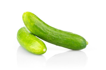 Two fresh green mini cucumbers isolated on white background.