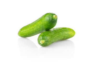 Two fresh mini cucumbers isolated on white background.
