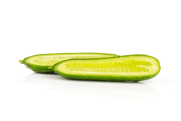 Fresh green mini cucumber two section halves isolated on white background.