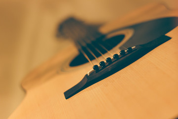 The image of an acoustic guitar, a musical instrument.
