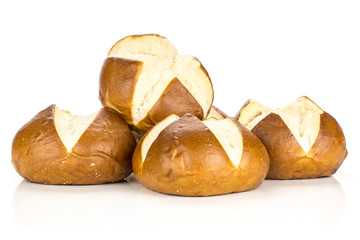 Fresh Bavarian bread buns heap isolated on white background four baked loaves.