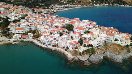 Naklejka na ściany i meble Aerial drone bird's eye view of iconic and picturesque Andros island chora, Cyclades, Greece