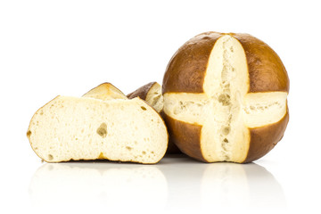 Bavarian bread buns with one secton half isolated on white background fresh baked loaves.