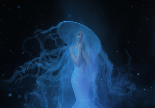 A white mermaid, with very long and blue hair floating under the water. An unusual image, the tail of a jellyfish. Levitation and weightlessness. Pale skin, gentle makeup. Art photo