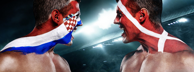 Soccer or football fan with bodyart on face with agression - flag of Croatia vs Denmark.
