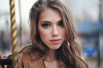 Fototapeta premium Young female face, outdoors portrait