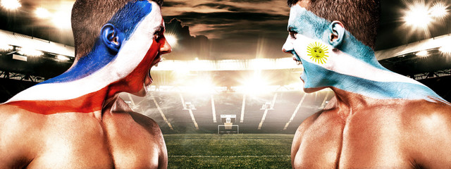 Soccer or football fan with bodyart on face with agression - flag of France vs Argentina.