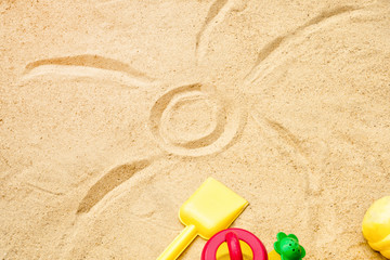 Fototapeta na wymiar Beach Summer Sun Sand Kids Toys and bottle water slippers and Sunscreen