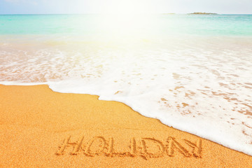 Beautiful sunny beach by the blue sea. Word 