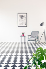 Spacious checkerboard interior with poster