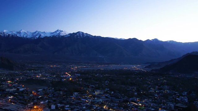 Scenic day to night of ladakh city background with himalaya mountain range