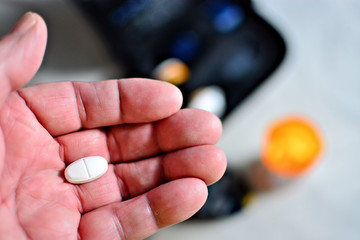 A senior contemplates taking another pill for diabetes
