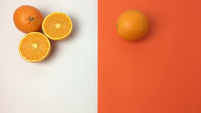 Naranja rodando se para frente a otra cortada por la mitad.