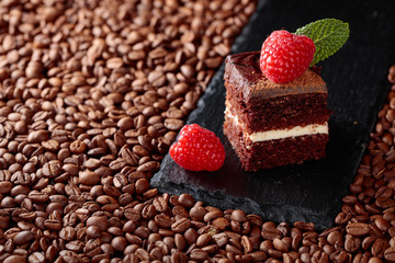 Closeup of chocolate cake with raspberry .