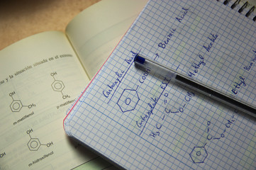 Some formulas of organic chemistry in a student's class notebook.