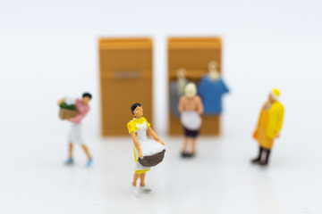 Miniature people : Housewives hire laundry - ironing, profitable business. Image use for housework, business concept.