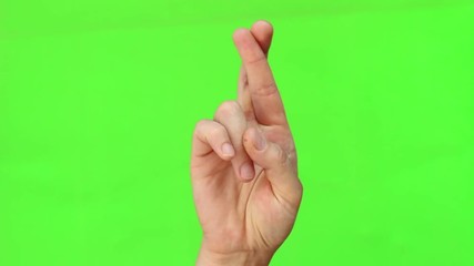 To cross one's fingers is a hand gesture commonly used to wish for luck. Green screen compositing