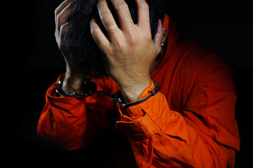 Stressed by prisoners shackled in a dark room