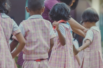 Young Kids exercise with hoola hoop in the morning.