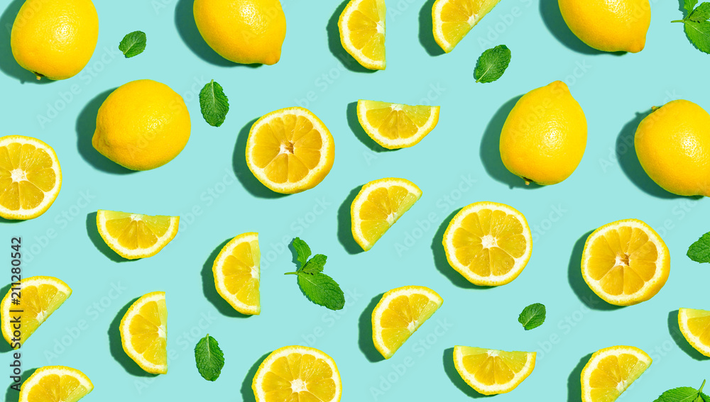 Wall mural fresh lemon pattern on a bright color background flat lay